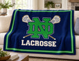 The Notre Dame Crossed Sticks Lacrosse Blanket