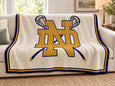 The Notre Dame Crossed Sticks Lacrosse Blanket