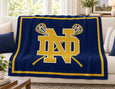 The Notre Dame Crossed Sticks Lacrosse Blanket